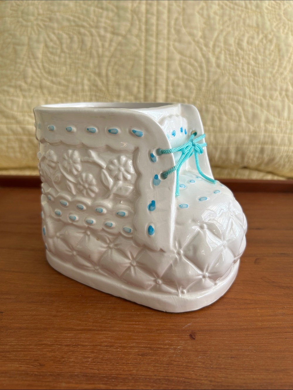 Vintage Ceramic baby bootie planter Embossed floral design and turquoise ribbon.